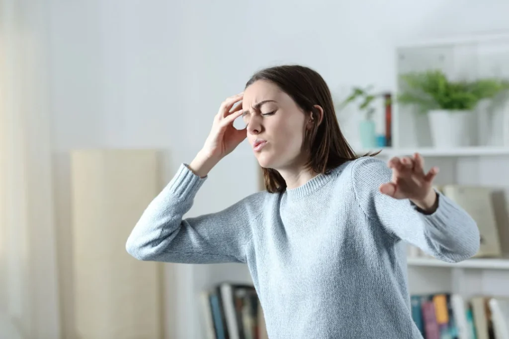 A young girl facing headache. 